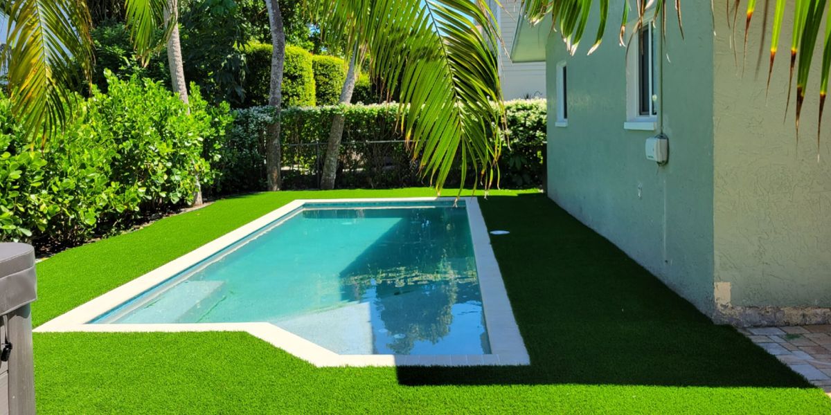 After: the same pool finished and surrounded by synthetic turf